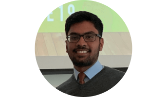 Faraz holding an award certificate